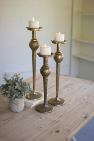 SET OF THREE ANTIQUE BRASS FINISH CANDLE STANDS